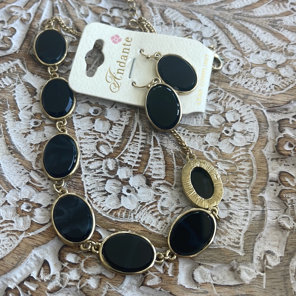 New black and gold toned costume necklace set with earrings, adjustable length